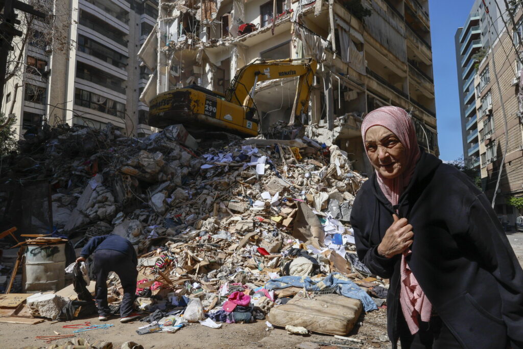 epaselect epa12877036 A woman walks next to a destroyed residential building the day after an Israeli airstrike in the Ain Mreisseh neighborhood of Beirut, Lebanon, 09 April 2026. At least 182 people were killed and more than 890 others injured after Israeli airstrikes hit multiple locations across Lebanon on 08 April, the Lebanese Ministry of Health reported. Israel launched a large-scale attack across Lebanon, including central Beirut, a day after the US and Iran agreed to a ceasefire. The Israeli government said the ceasefire does not cover Lebanon and that strikes on Hezbollah locations will continue.  EPA/WAEL HAMZEH